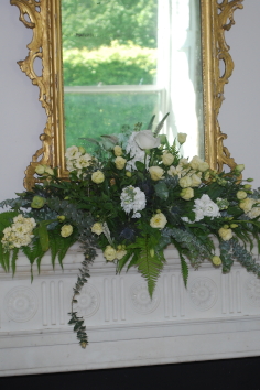 Mantle piece flower arrangement by Chrisses Wedding Flowers