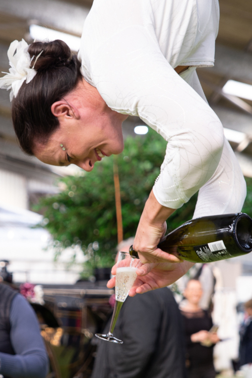 A close up of Lisa W champagne pouring  | The 2 Lisas - photography by Elizabeth Melvin