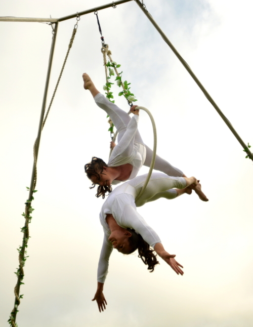 The 2 Lisas performing doubles hoop on their outdoor aerial rig | Photographer Cian Attems