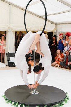 The 2 Lisas performing on the lolipop lyra at a marquee wedding.