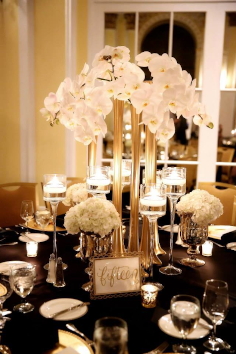 Gold and Black themed table setting.
