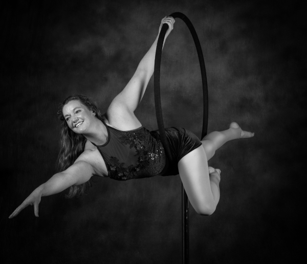 Lisa T with a beautiful smile on a Lollipop hoop | Photographer Glenn Balsam