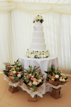 Beautiful 6 tiered white wedding cake by Donna Mears