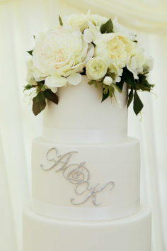 Beautiful white flowered wedding cake by Donna Mears