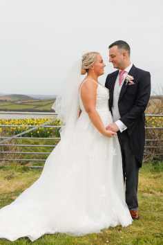 The happy couple at Trerethern Farm and the Camel estuary in the background.