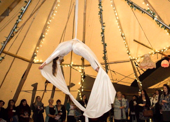 Aerial silks entertainment by The 2 Lisa's in a beautiful fairy lit tipi.