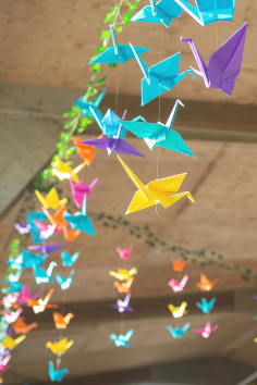Hanging colourful orgigami cranes.